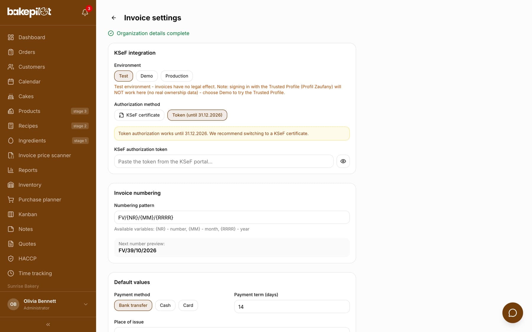 Invoice settings: an Organization details complete message, the KSeF integration section with a choice of environment (Test, Demo, Production) and authorization method (KSeF certificate, Token), the Invoice numbering section with the FV/{NR}/{MM}/{RRRR} pattern and a next number preview, and the start of the Default values section