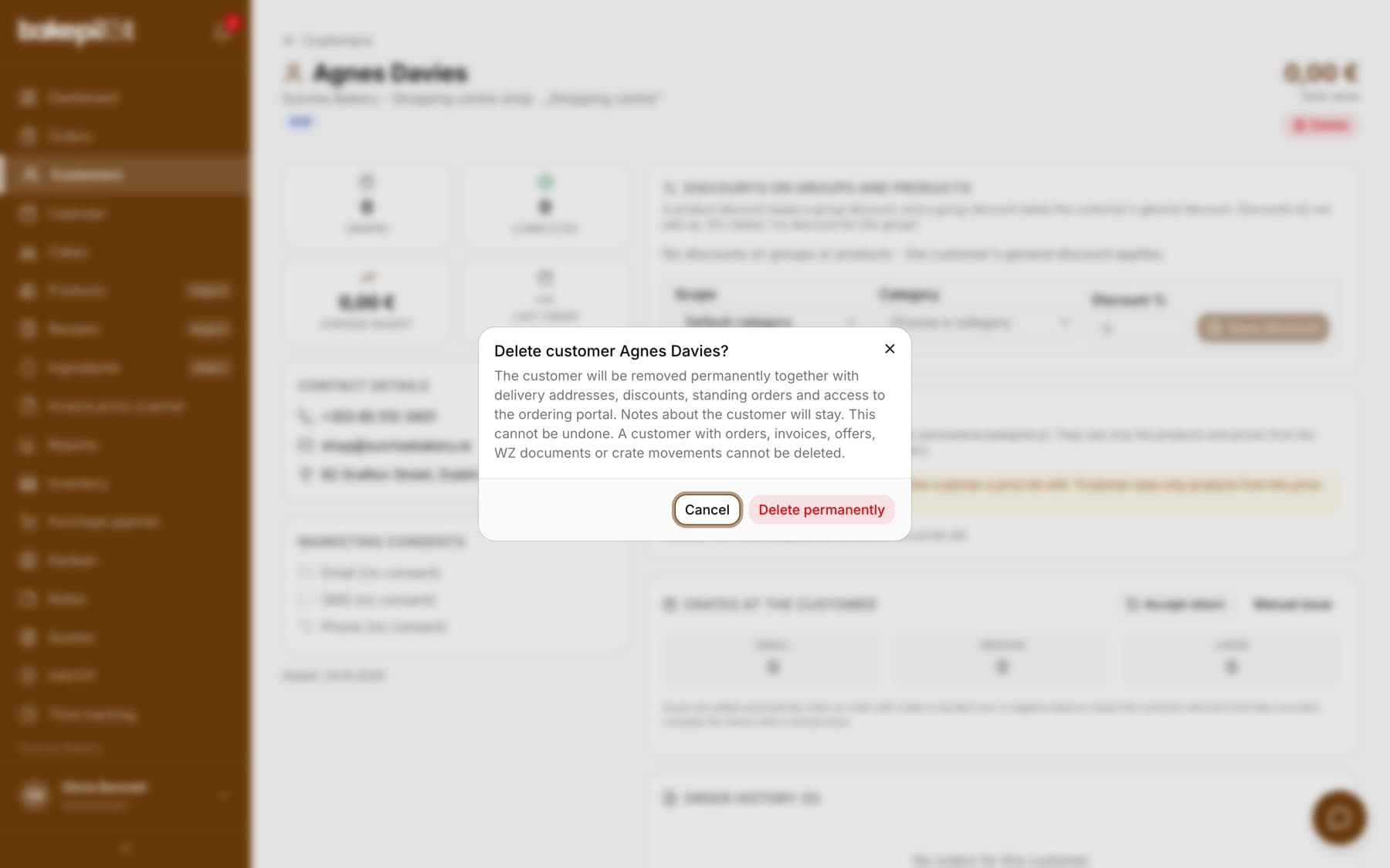 Delete customer window describing what will be removed together with the customer and that a customer with a sales history cannot be deleted, with the Cancel and Delete permanently buttons